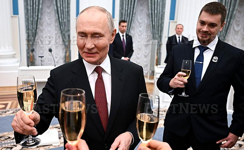 Russian President Vladimir Putin presents the 2025 Presidential Prize for Science and Innovation to young scientists during a ceremony held in St.