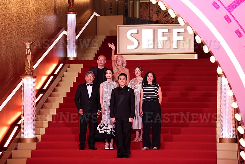 SHANGHAI, CHINA - JUNE 13: Actor Tony Leung Chiu-wai and actress Xin Zhilei arrive at the red carpet of the 28th Shangha