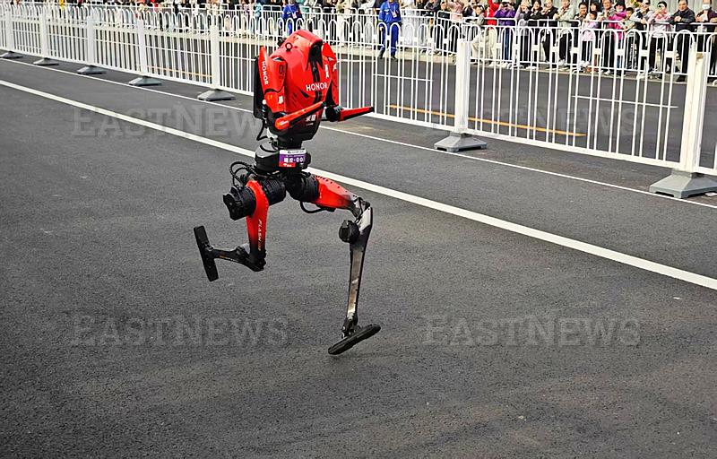 BEIJING, CHINA - APRIL 19: A humanoid robot runner competes in the 2026 Beijing E-Town Humanoid Robot Half-marathon on A